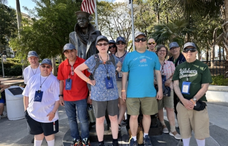 Travelers stopped by a monument to the sailors on our riverwalk.