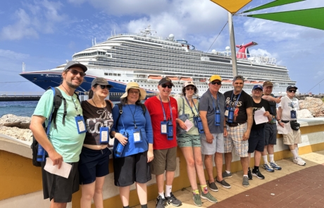 Travelers standing with the ship, Carnival Horizon in the background