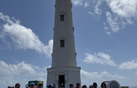 California lighthouse with the travelers on Aruba