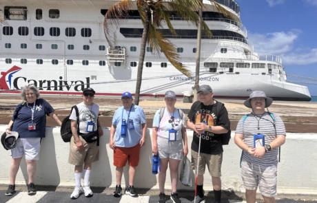 Travelers standing in front of the Carnival Horizon ship