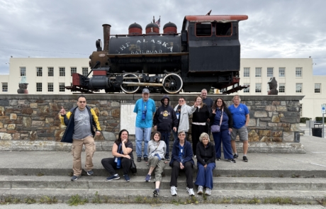 IMG_5979 Travelers in front of The Alaska Railroad locomotor in Anchorage