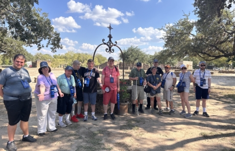 Travelers in front of well at the Missions