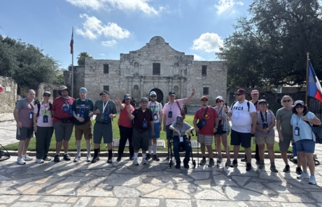 The travelers and staff at the Alamo